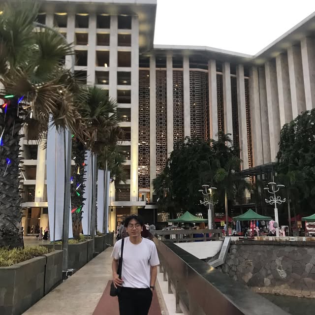 Rizki in front of the Istiqlal mosque in Jakarta